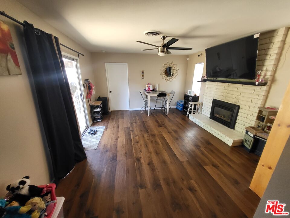 2831 Pine Street Bakersfield, CA 93301 - Photo 26 of 33 a living room with furniture and a flat screen tv