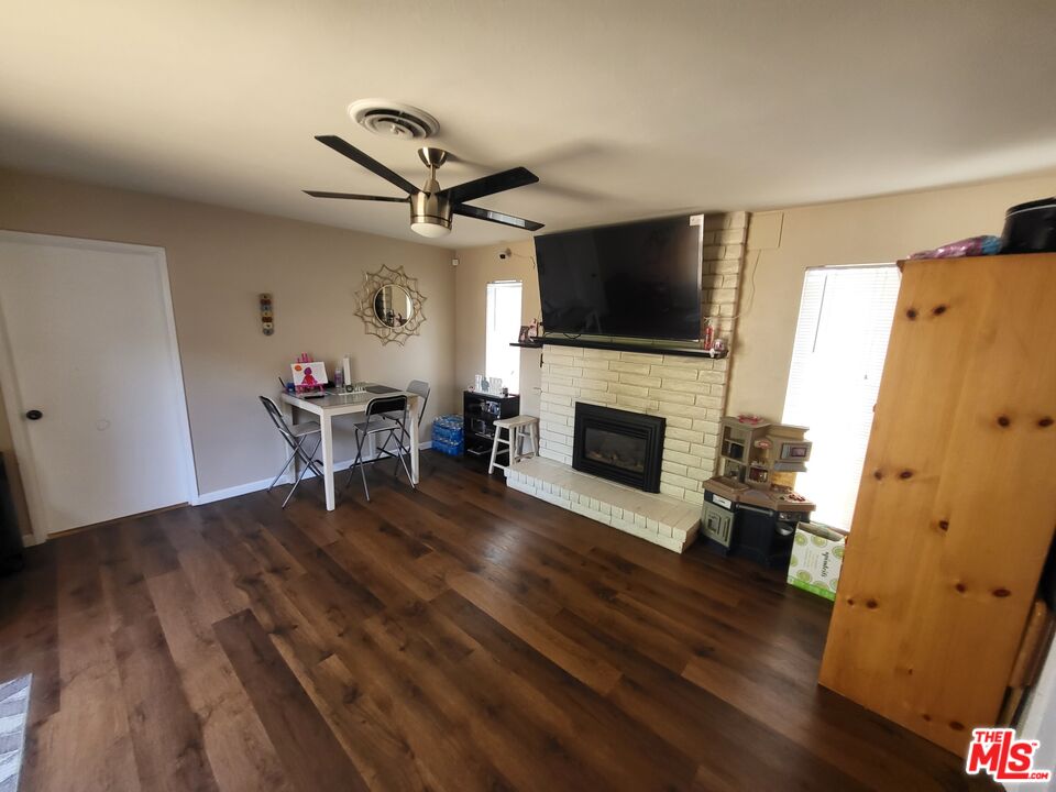 2831 Pine Street Bakersfield, CA 93301 - Photo 28 of 33 a living room with furniture and a fireplace