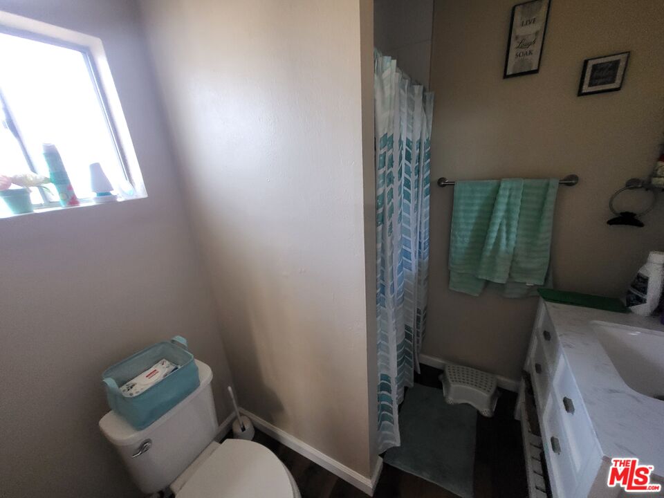 2831 Pine Street Bakersfield, CA 93301 - Photo 29 of 33 a bathroom with a toilet and a sink