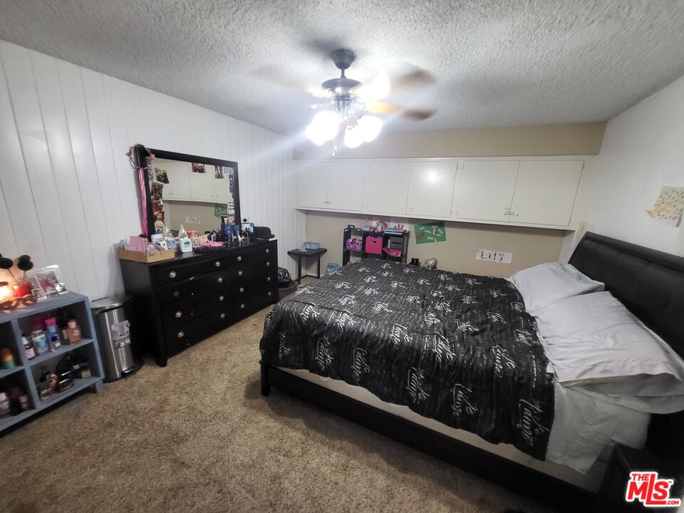 2831 Pine Street Bakersfield, CA 93301 - Photo 31 of 33 a bed room with a bed and a dresser