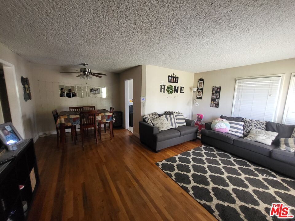 2831 Pine Street Bakersfield, CA 93301 - Photo 8 of 33 a living room with furniture and wooden floor