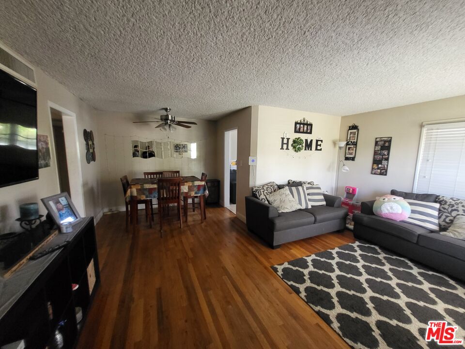 2831 Pine Street Bakersfield, CA 93301 - Photo 10 of 33 a living room with furniture and a flat screen tv