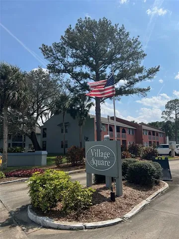 a view of a chairs and table in a yard