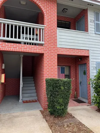 a view of a porch with chairs and backyard