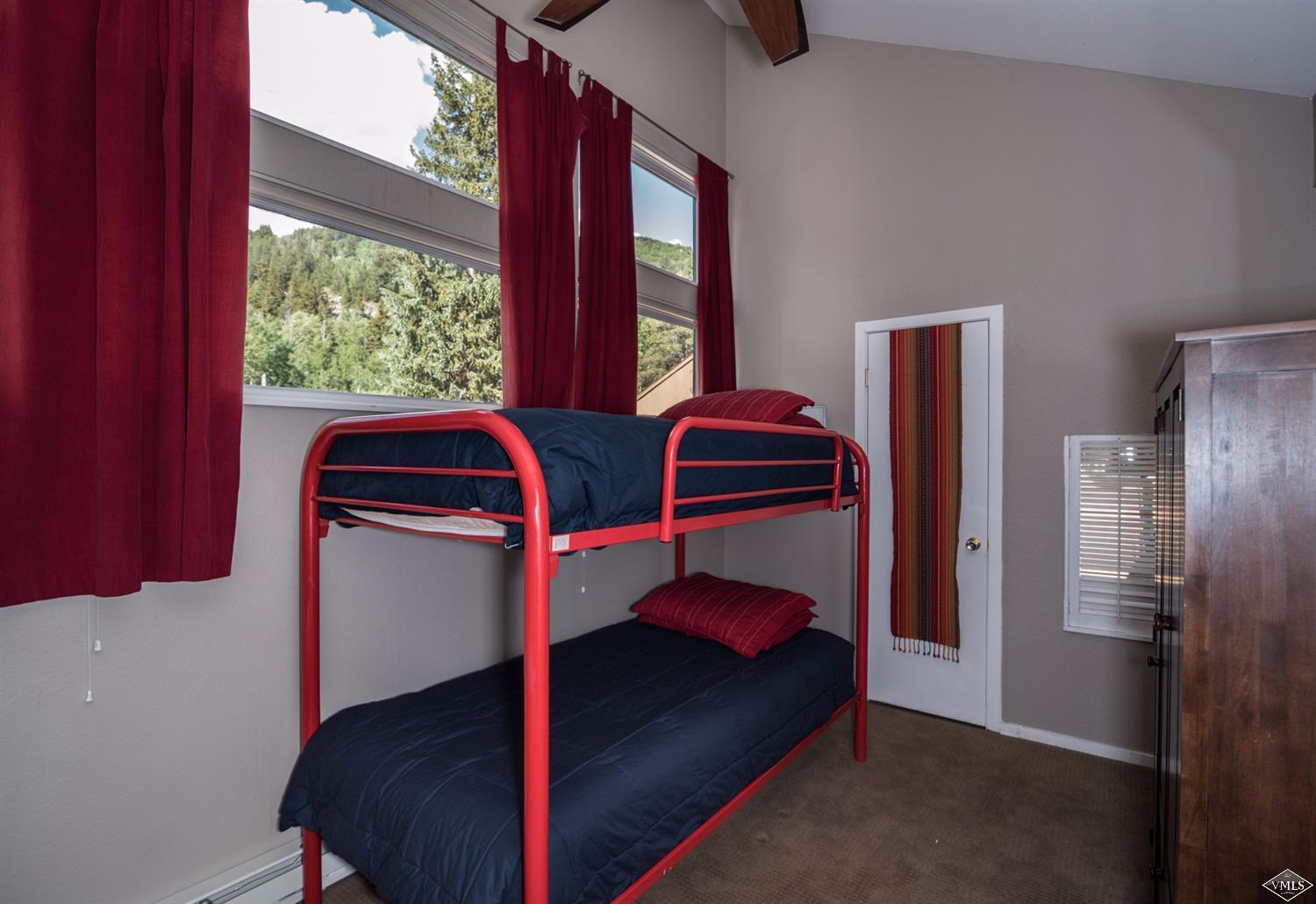 3901 Big Horn Road, Unit 2H Vail, CO 81657 - Photo 12 of 16 a bedroom with a bed and a window