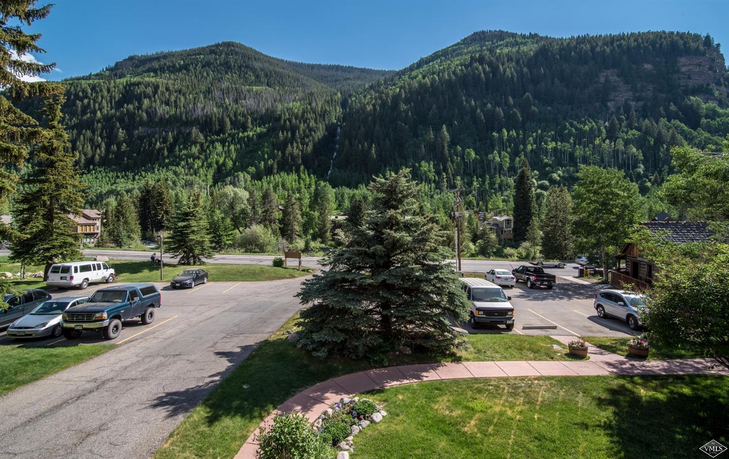 3901 Big Horn Road, Unit 2H Vail, CO 81657 - Photo 15 of 16 a view of a park that has a lots of trees and cars parked