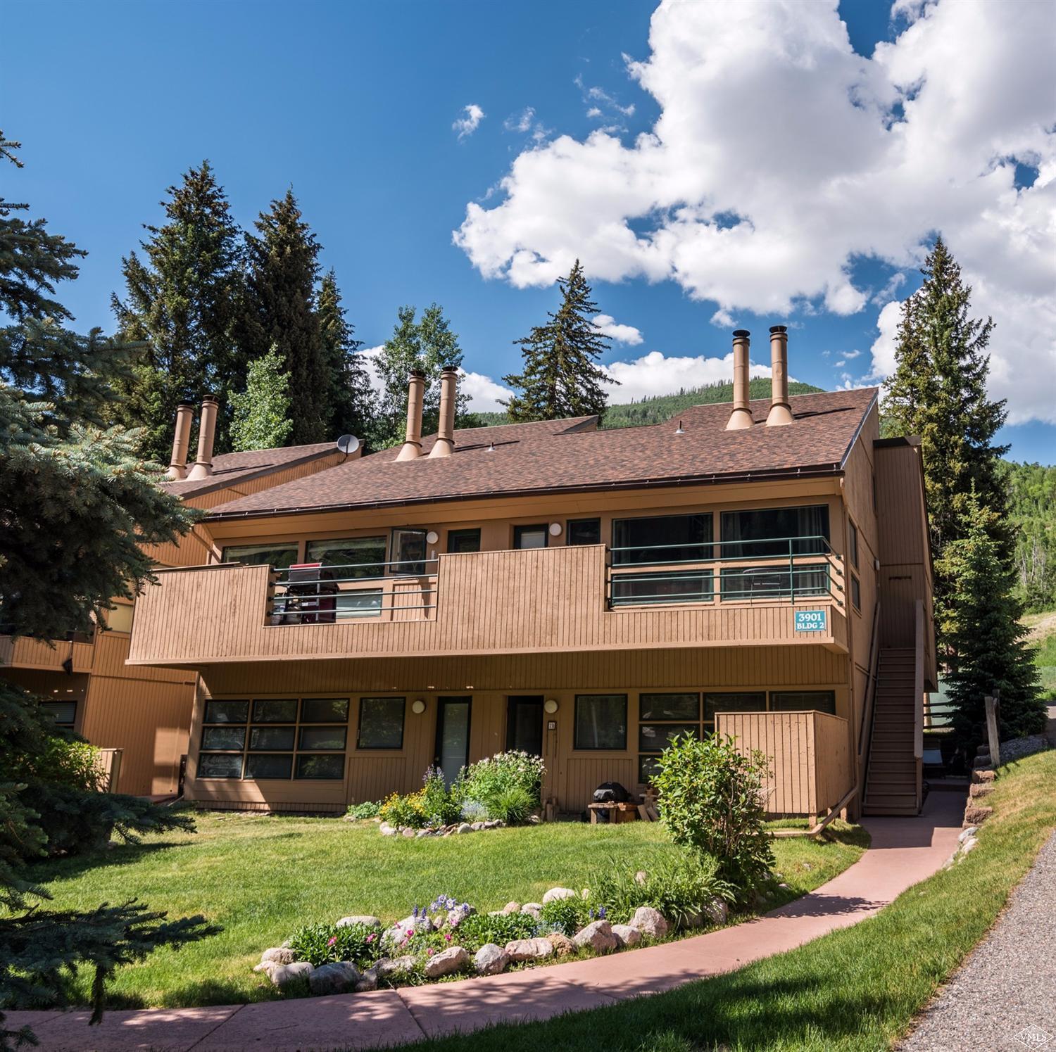 3901 Big Horn Road, Unit 2H Vail, CO 81657 - Photo 2 of 16 front view of a house with a garden