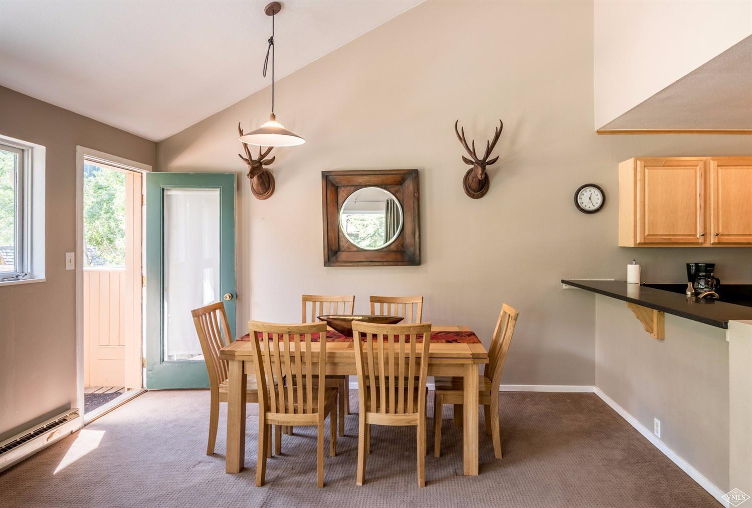 3901 Big Horn Road, Unit 2H Vail, CO 81657 - Photo 9 of 16 a dining room with furniture and window