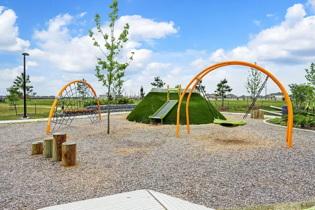 a view of a lake with a garden in the background
