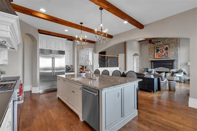a living room with furniture fireplace and flat screen tv
