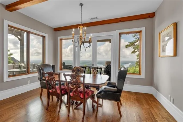 a room with lots of chairs and mirrors