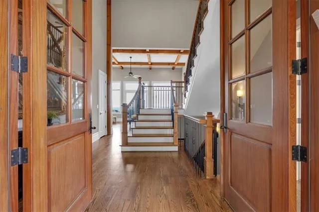 a view of roof deck with couches and potted plants