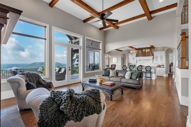 a large bathroom with a granite countertop double vanity sink a mirror and a shower