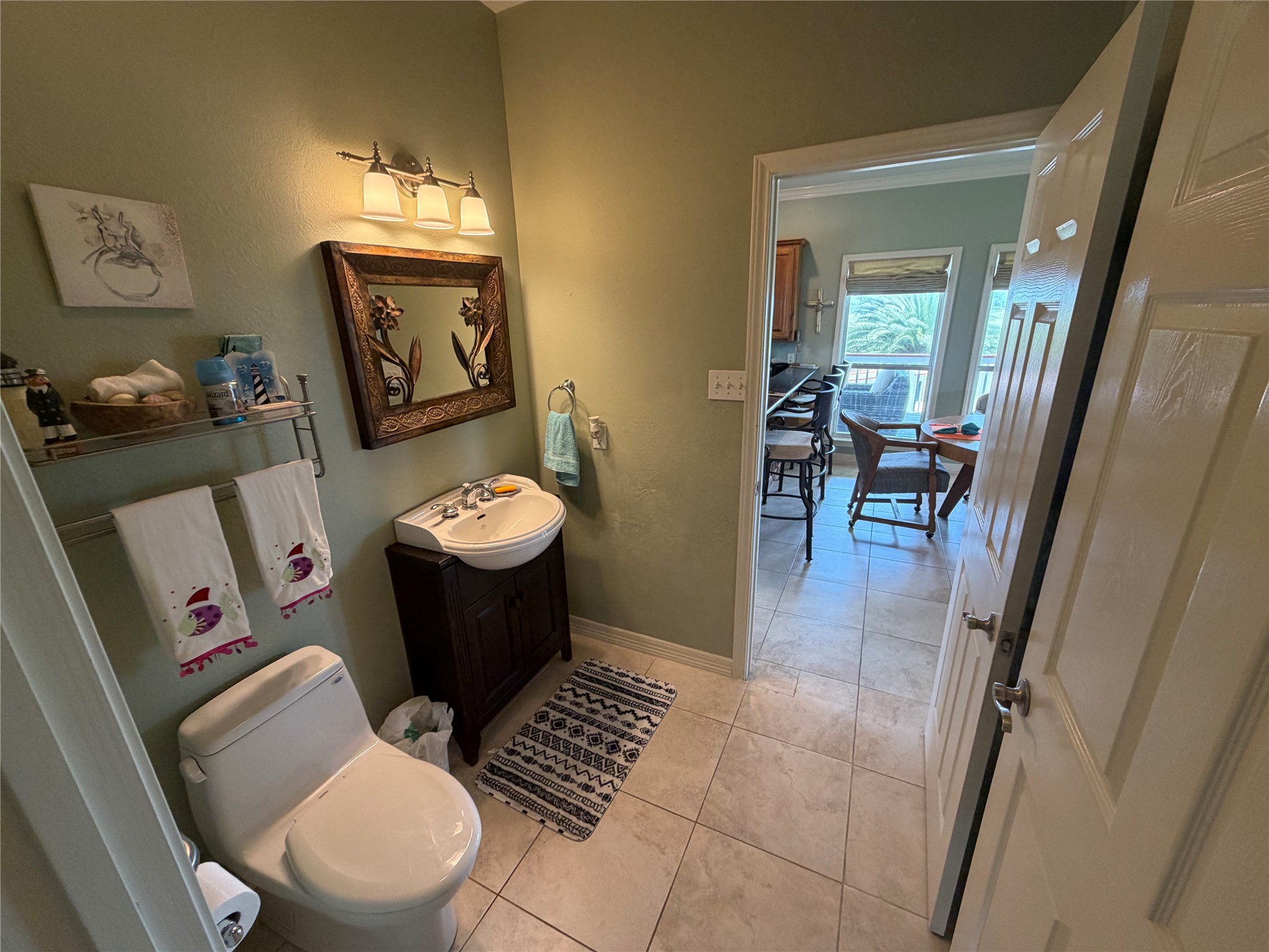 979 Rancho Carribe Drive Crystal Beach, TX 77650 - Photo 37 of 50 Separate toilet and lavatory for easy use from dining area