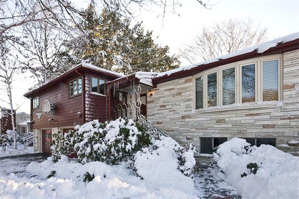 115 Adeline Road Newton, MA 02459 - Photo 1 of 1 a front view of a house with a yard covered with snow