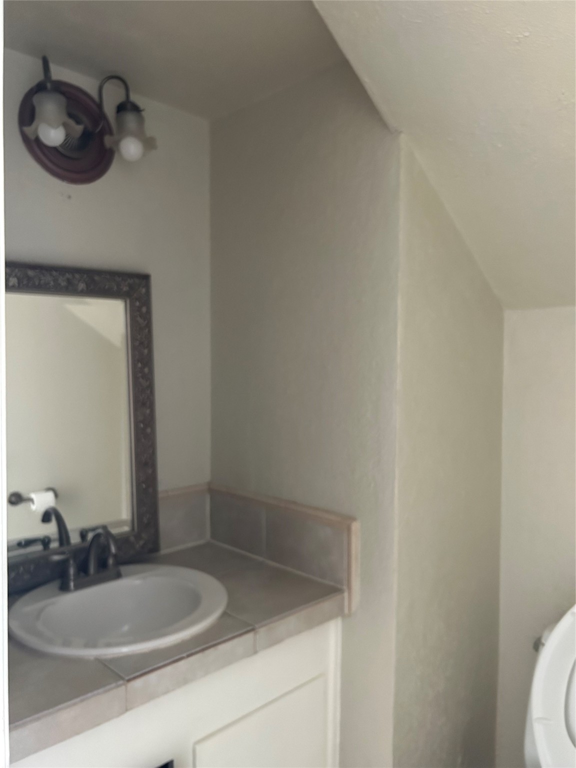 1403 Blalock Road, Unit 16 Houston, TX 77055 - Photo 6 of 12 a bathroom with a sink and a mirror