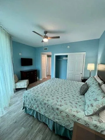 a view of a livingroom with furniture and a hallway
