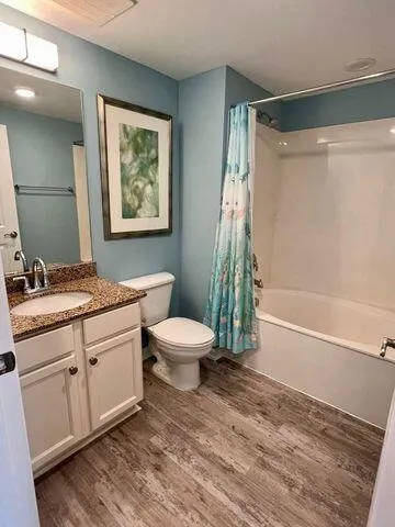 a kitchen with stainless steel appliances granite countertop a refrigerator stove top oven and sink