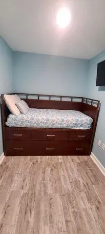 a room with furniture and a wooden floor