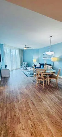 a view of a swimming pool with outdoor seating and plants