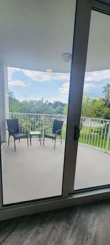 a view of a lobby with black carpet