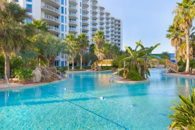 a balcony with table and chairs