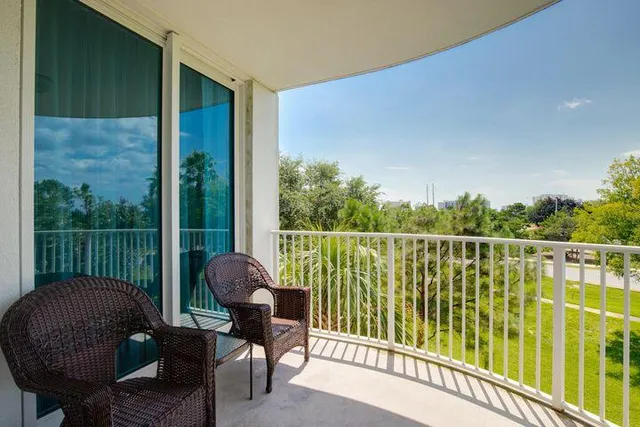 a balcony with chairs