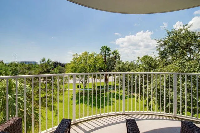 a bedroom with a large bed and a flat screen television