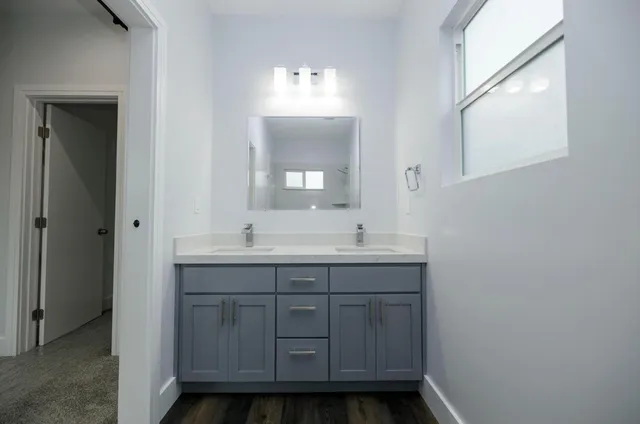 a bathroom with a sink and a mirror