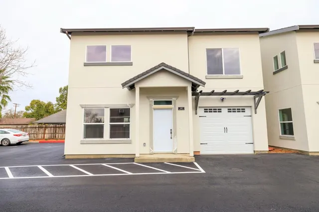 a front view of a house with a garage