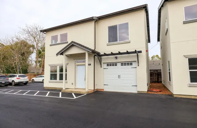a view of a house with a street