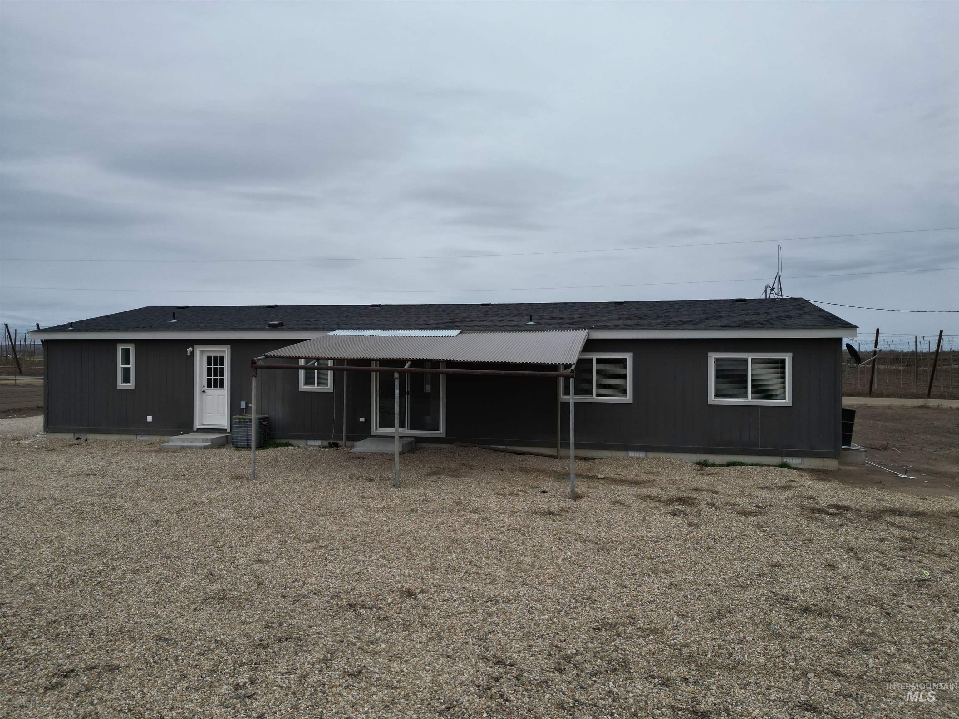 26915 Chips Lane Parma, ID 83660 - Photo 19 of 48 Rear view of property with a shingled roof