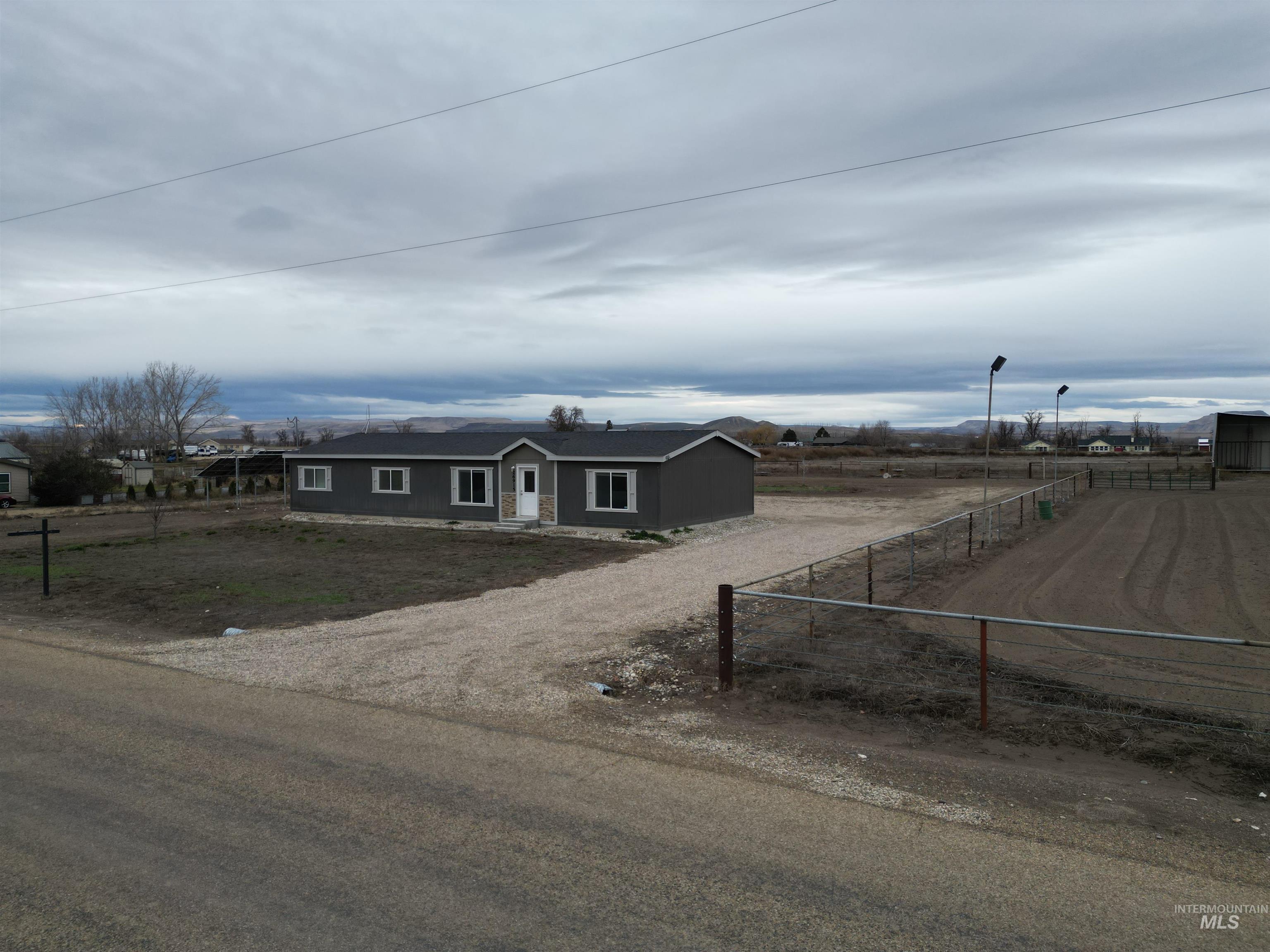 26915 Chips Lane Parma, ID 83660 - Photo 23 of 48 Ranch-style home featuring dirt driveway and a view of rural / pastoral area