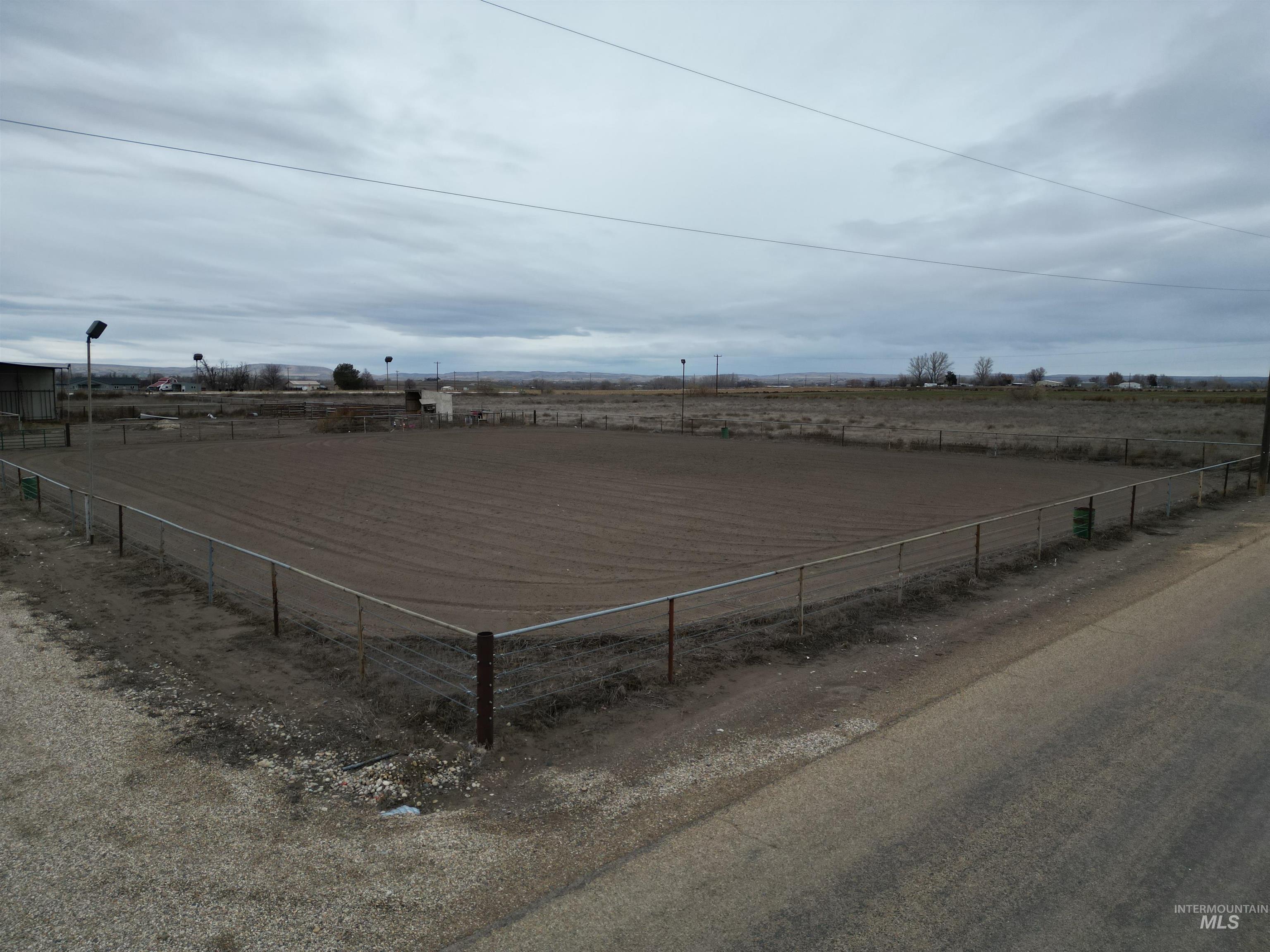26915 Chips Lane Parma, ID 83660 - Photo 25 of 48 View of yard with a view of countryside and an enclosed riding area