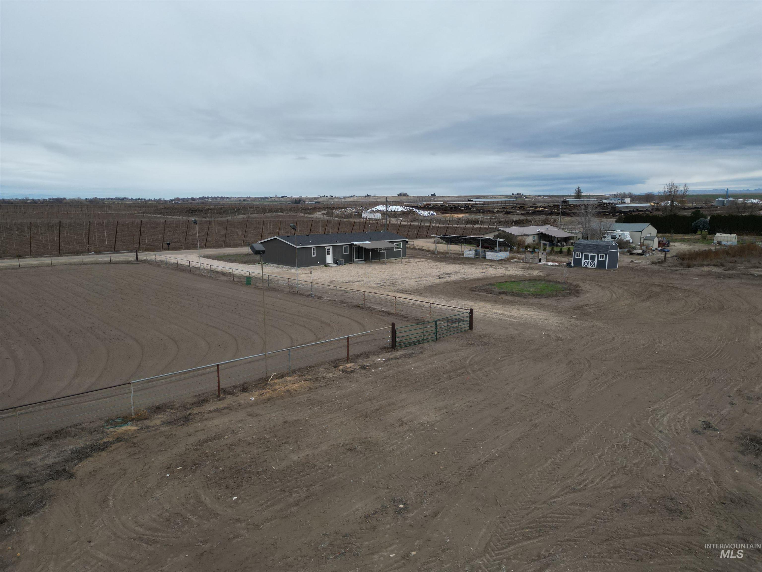 26915 Chips Lane Parma, ID 83660 - Photo 29 of 48 View of dirt / gravel road featuring an enclosed riding area and a rural view