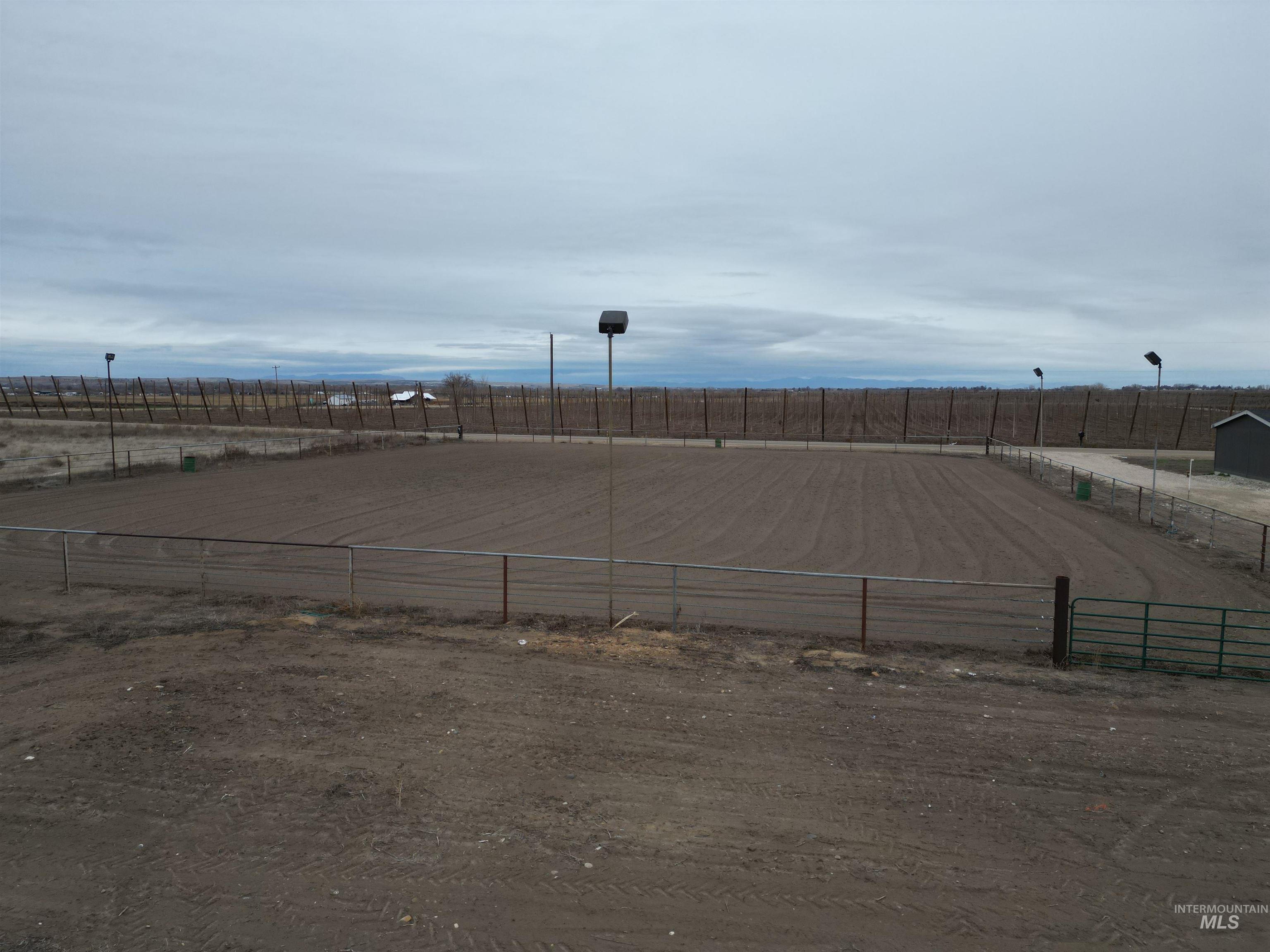 26915 Chips Lane Parma, ID 83660 - Photo 31 of 48 View of parking / parking lot with a view of rural / pastoral area and an outdoor riding arena