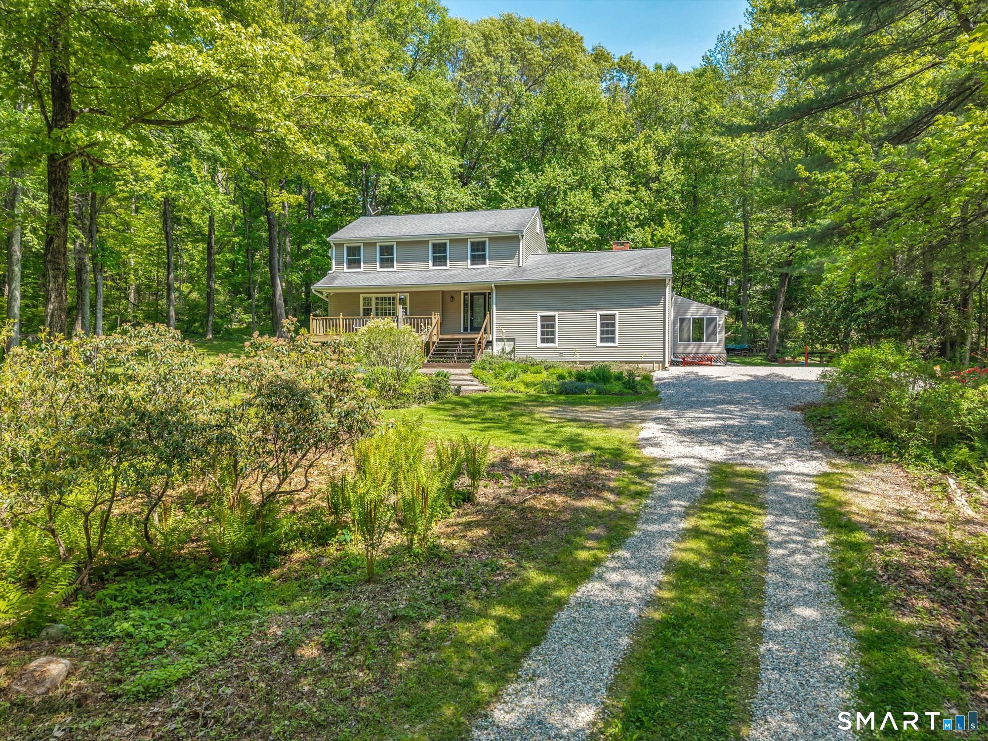 59 Indian Hill Road Canton, CT 06019 - Photo 3 of 39 a view of a house with a big yard and large trees