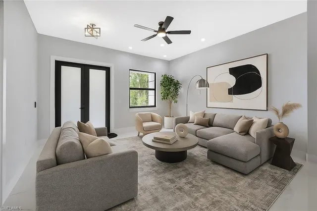 a living room with furniture and a large window