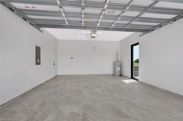 a view of an empty room with chandelier