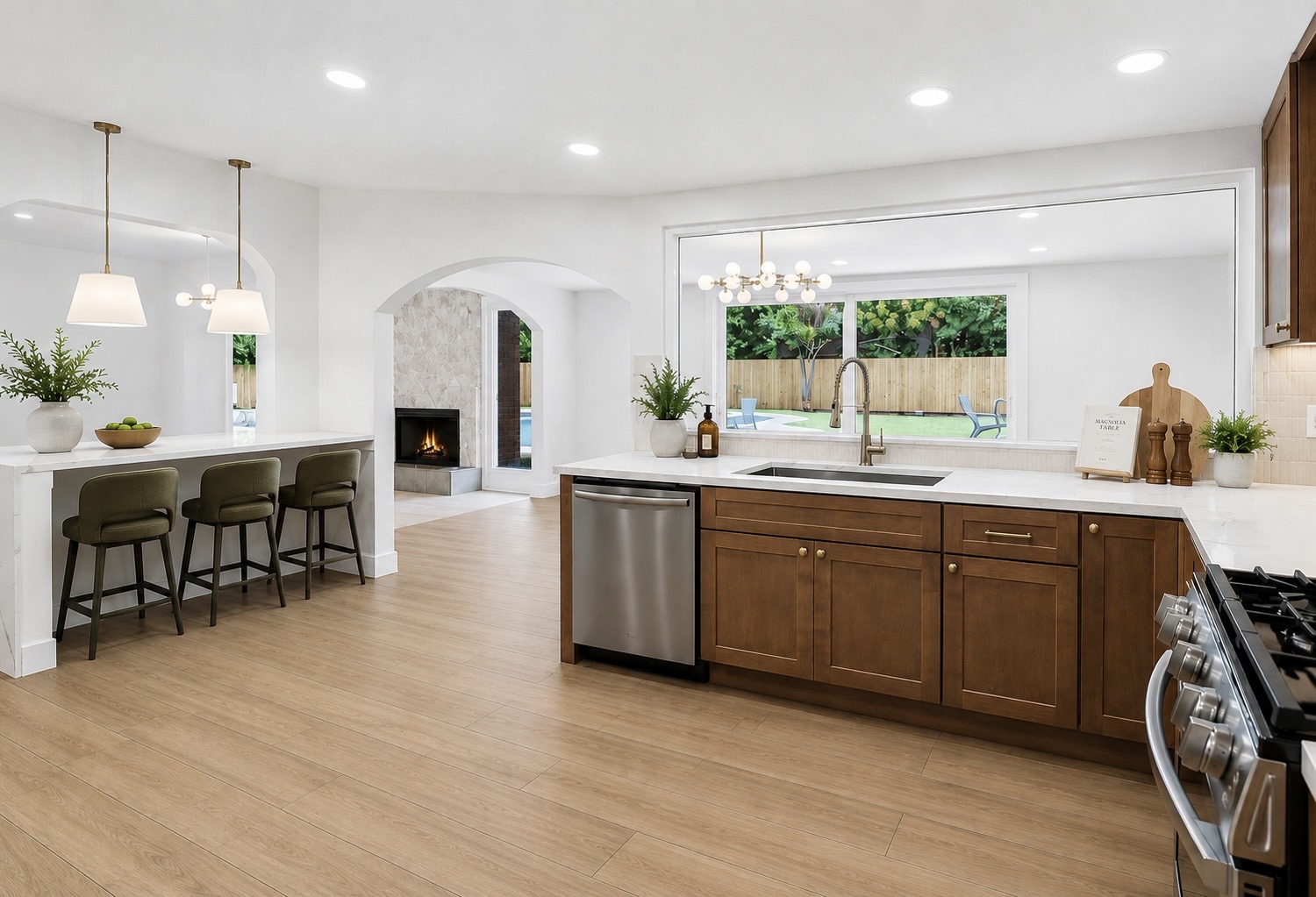 11809 Charing Cross Road Austin, TX 78759 - Photo 7 of 34 Gleaming wood-look flooring and recessed lighting define this open-concept kitchen.