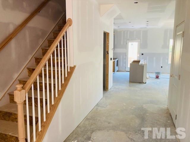 813 Star Rdg Drive Raleigh, NC 27610 - Photo 3 of 21 a view of a hallway with wooden floor and windows