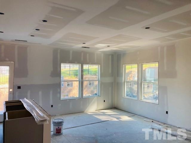 813 Star Rdg Drive Raleigh, NC 27610 - Photo 4 of 21 a view of an empty room with a window