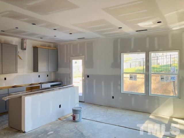 813 Star Rdg Drive Raleigh, NC 27610 - Photo 6 of 21 a kitchen with a sink window and cabinets