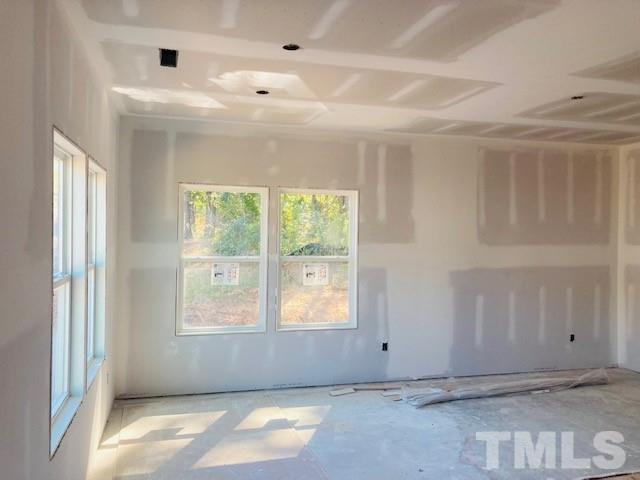 813 Star Rdg Drive Raleigh, NC 27610 - Photo 7 of 21 a view of an empty room with a window