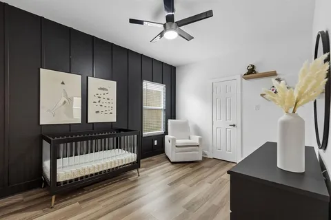 a bedroom with furniture and a window