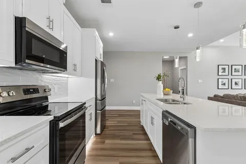 a kitchen with a stove and a microwave