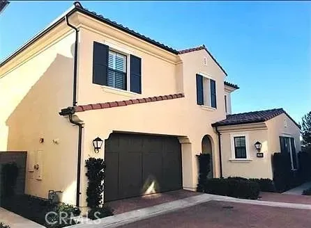 a front view of a house with garage