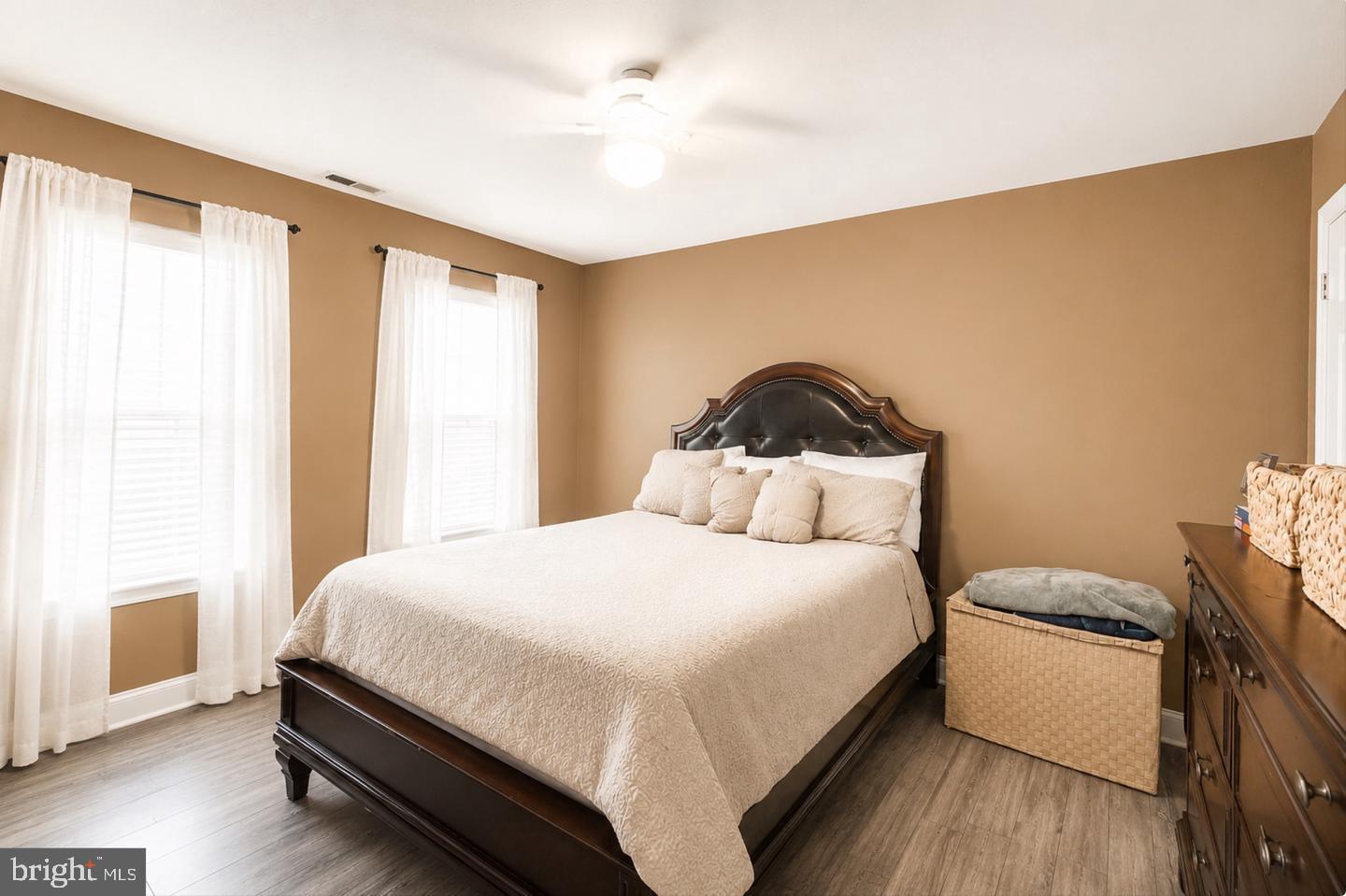 3915 Flowerton Road Baltimore, MD 21229 - Photo 7 of 15 a bedroom with a bed and a potted plant