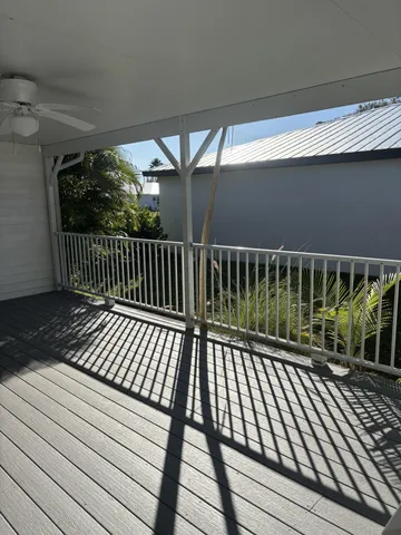 a view of balcony with wooden floor