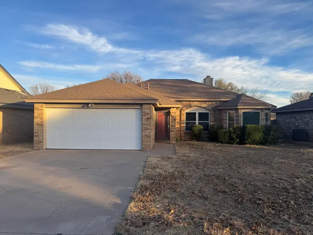 front view of a house with yard